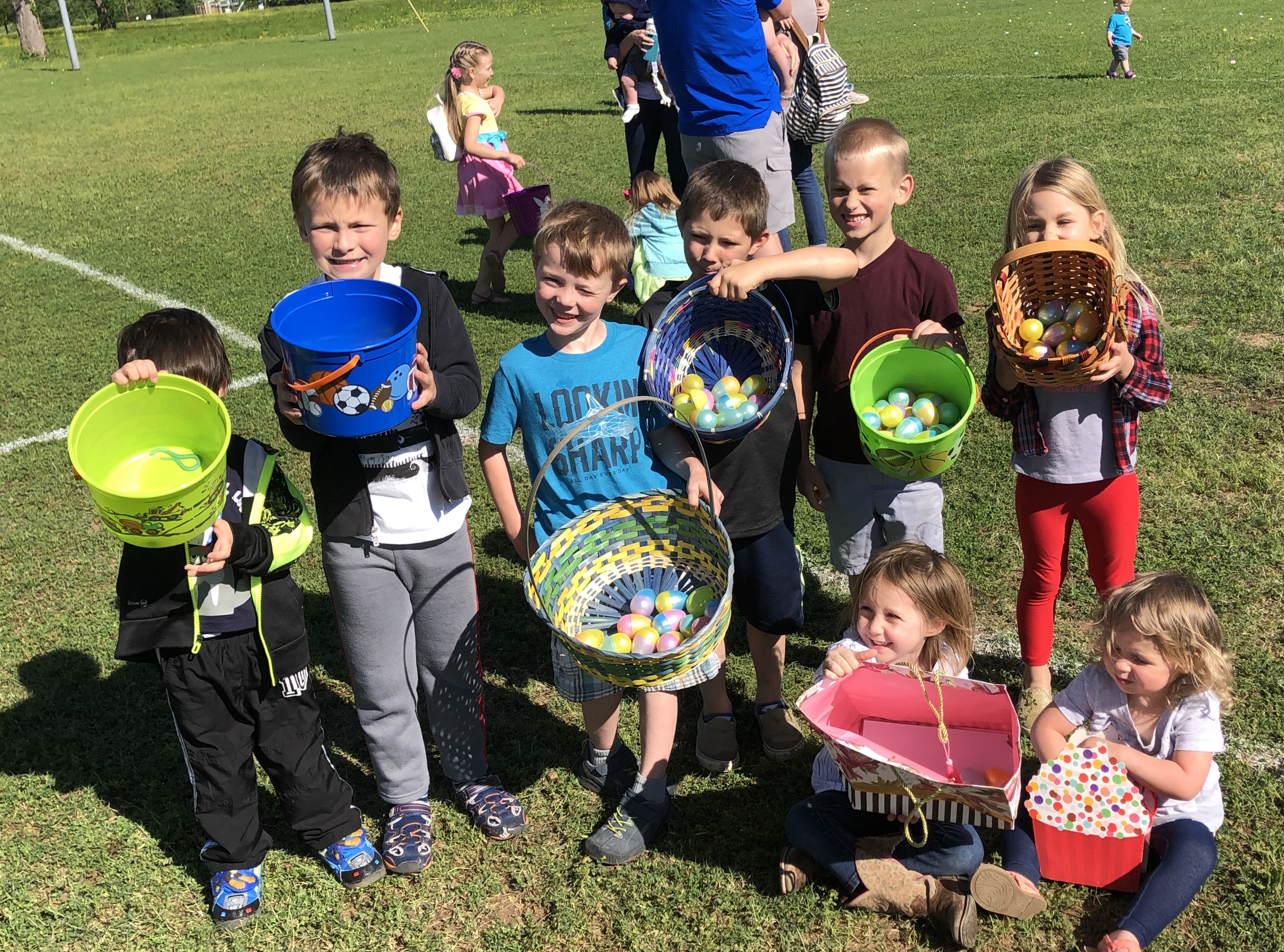 Youth scramble for Easter eggs at YMCA hunt Elgin Courier
